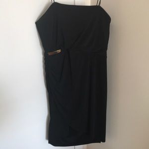 Strapless LBD with gold bar detail.
